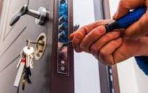 Locksmith repairing a lock