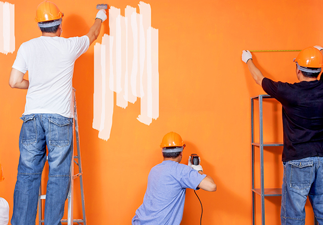 Contractor painting a wall